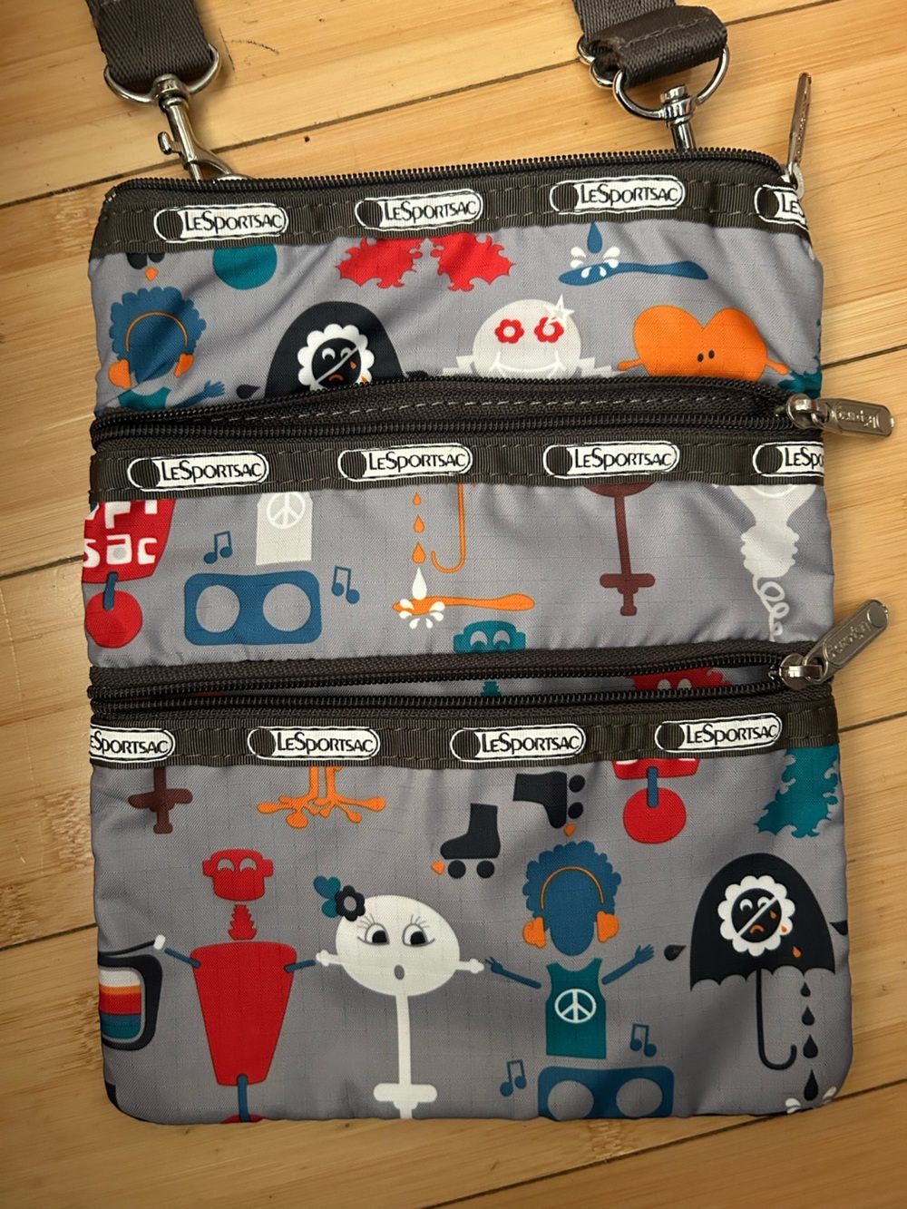 LeSportsac Gray Crossbody Bag with Orange, Blue & Red Robot Character Print